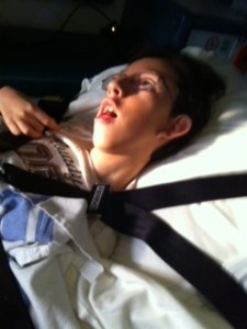 The early morning sun shining on Deane in the ambulance