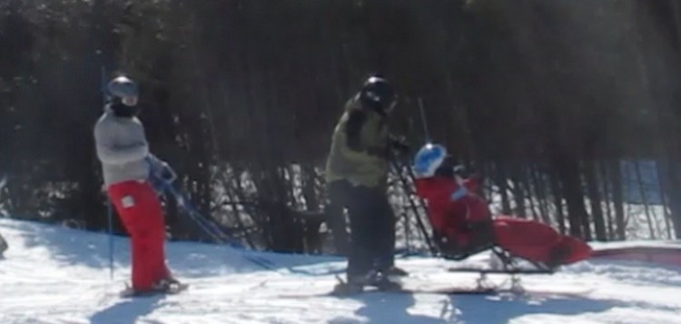 Skiing earlier this winter at our nearby ski hill where we have been developing our sit skiing skills.