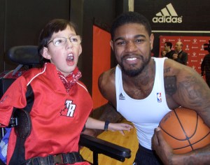 A young Deane with Raptor player Amir Johnson. He remains a huge fan.